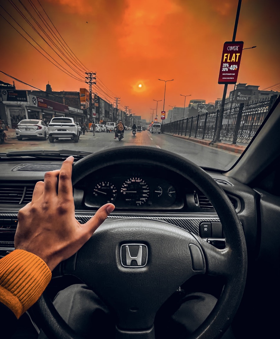 The city drive, graded with a golden orange sky