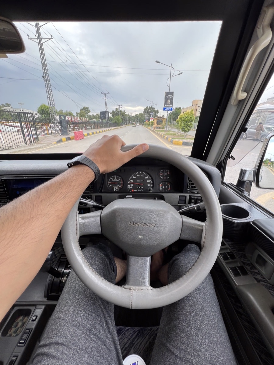 A Land Cruiser drive under grey skies, as shot